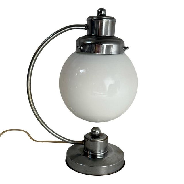 Art deco style lamp that resembles the designs of Gispen. Comes with an opaline shade, and has been rewired. The base is...