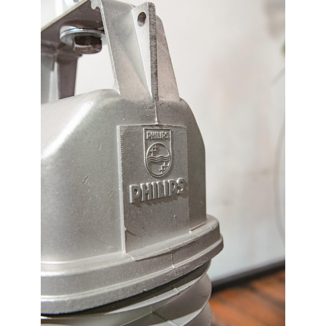 A 1950s philips hdk series factory pendant light in grey enamel with a cast aluminum top, made in the netherlands. An...