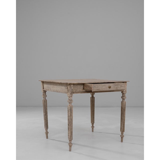 This 19th Century French Provincial oak side table showcases the understated charm and utility characteristic of rural...