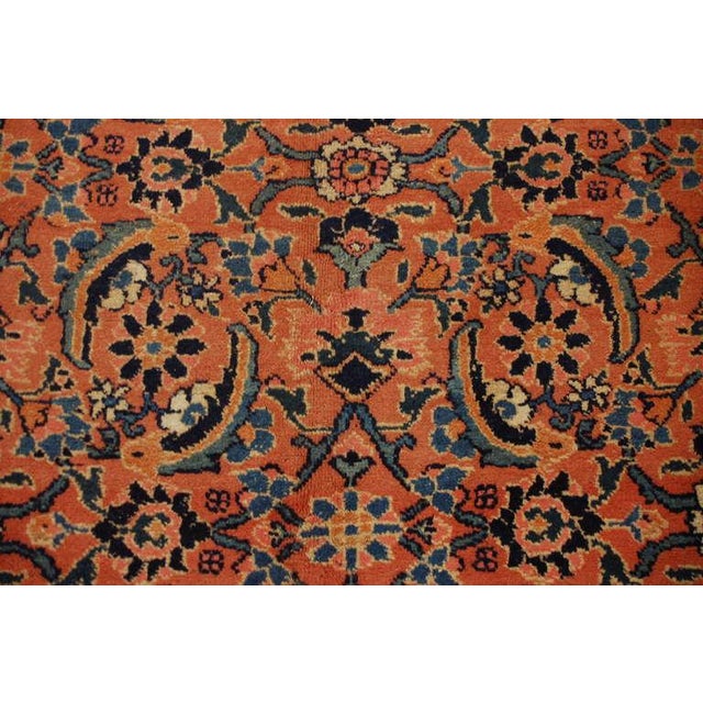 An exceptional early 20th century Persian Tabriz rug with all-over tree-of-life pattern on a vibrant salmon-colored...