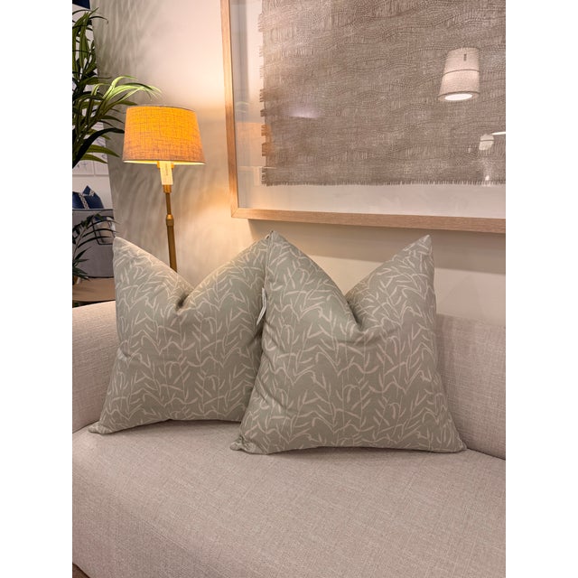 This cotton-linen blend (95% cotton & 5% linen) washable decorative pillow features a soft sage green background with a...