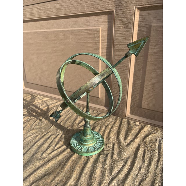 A stunning vintage English country or Neoclassical style green brass verdigris garden armillary sundial with Roman...