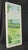 Original artwork painted on an old window pane depicting a garden scene with a stone wall and rolling hills in the...