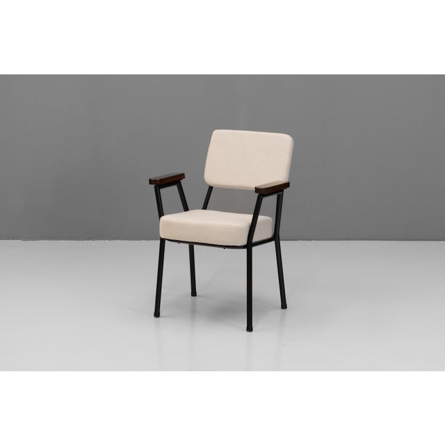 Pair of mid-century steel framed side chairs by T Murphy. with solid teak rounded arms and recovered in a beige linen. U.K...