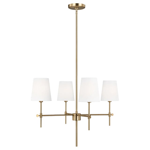 The Baker four light single tier chandelier in satin brass supplies ample lighting for your daily needs, while adding a...