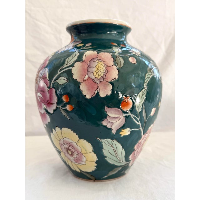 Vintage Chinese embossed vase with hand painted peonies. Gorgeous vibrant peonies against a dark green / teal backdrop....