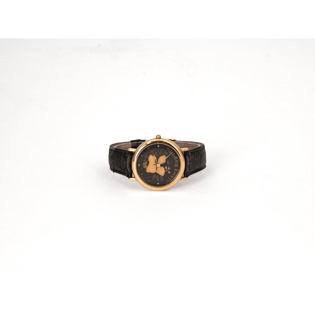 Vintage women's watch by Laura Biagiotti (1990s) featuring Italian design and a Swiss movement. The standout feature of...