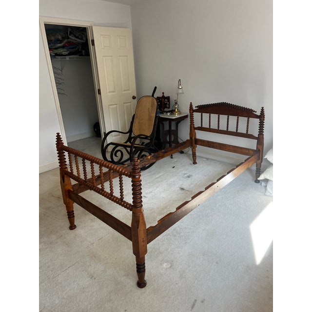 Up for consideration is a beautiful antique American walnut, Jenny Lind style, Federal spool twin size bedframe. This...