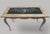 This is a vintage French Louis XV-style solid oak coffee table from the 1970s with an inlay ceramic mosaic top. Handmade...