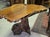Carved olive wood table, made from a single root this solid wood table is carved from a single piece of wood. its...
