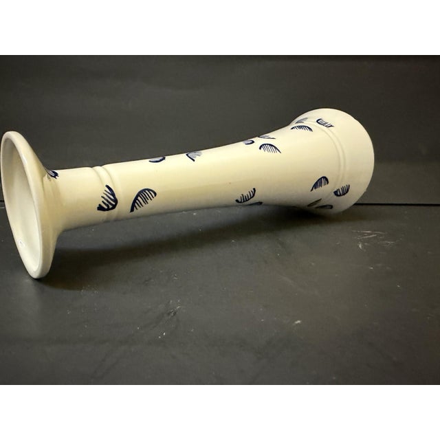 Enhance your tabletop or mantel with this elegant vintage candlestick holder, born from an exclusive mid-century...