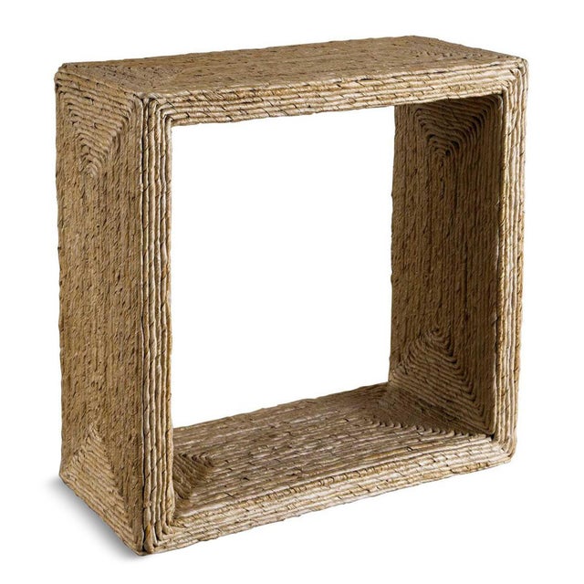 Natural banana leaf side table woven by hand. This narrow open cube side table brings an effortless organic character to...