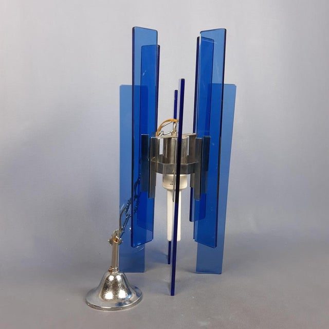 Wonderful elegant pendant chandelier, metal structure with blue glass sheets, excellent Italian manufacturing of excellent...