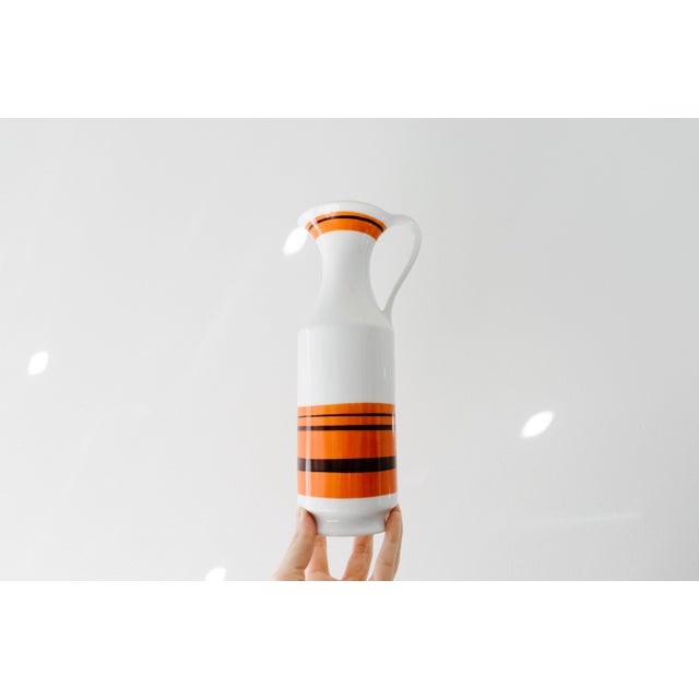 Collectible Mid Century handmade glazed porcelain pitcher vase by Royal Porzellan Bavaria KPM. Classic striped orange and...