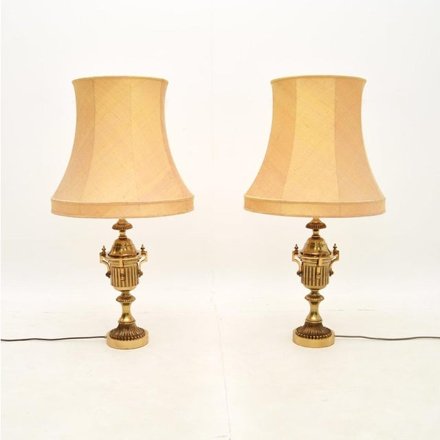 A stunning pair of antique neoclassical style brass table lamps. They were made in England, they date from around the...