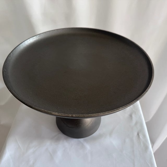 A modern and contemporary display for your tabletop created by Arteriors Home. The rich deep graphite, reads almost black....