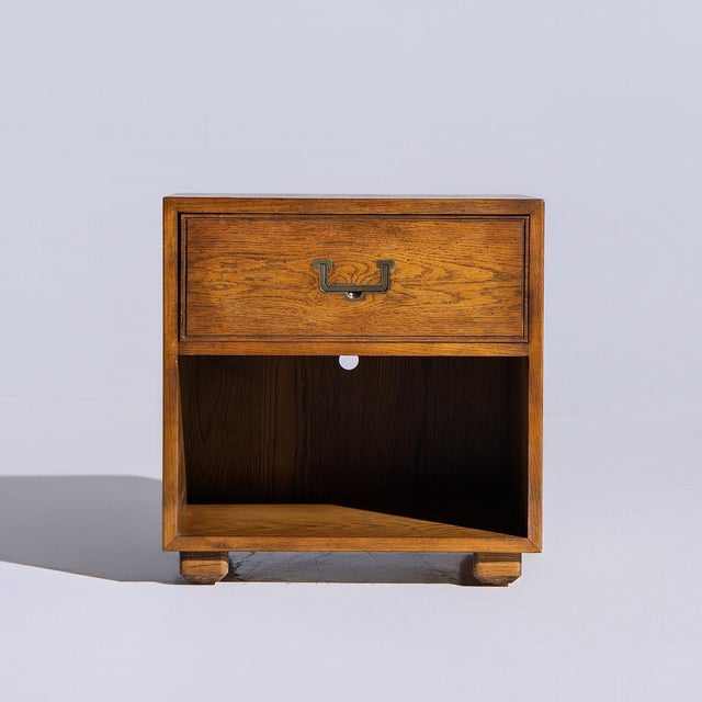 Henredon Campaign Mid Century Oak and Brass Nightstand This nightstand measures: 22 wide x 18 deep x 22.75 inches high...