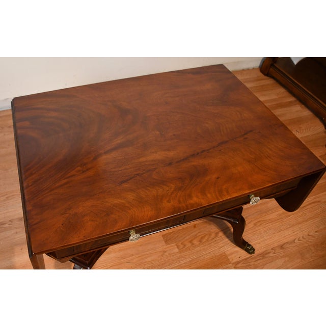 We are pleased to offer this beautiful Antique Federal Drop-leaf sofa table, from the 1860s. This Table is made of Flame...