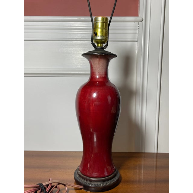 Here is a beautiful late 18th C early 19th C antique Chinese Oxblood Sang De Boeuf vase turned to a lamp around 50s. The...