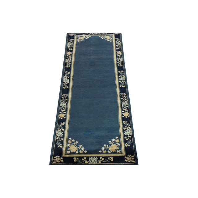 A 3x8 hand-knotted vintage runner connoting Chinese art deco inspirations of the 1920s, from the newest line of Rug &...