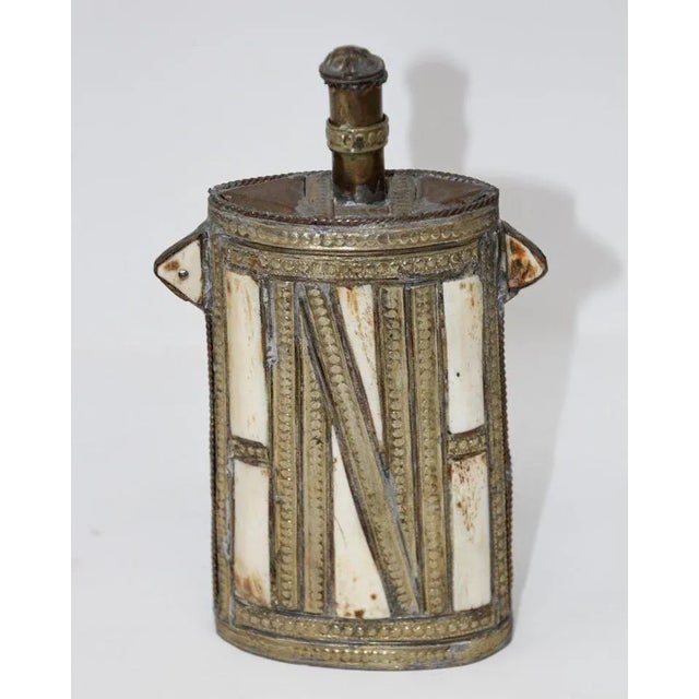 Great decorative Moroccan Berber Tuareg metal brass powder flask. African decorative brass with front richly decorated...