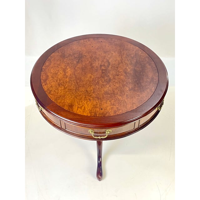 An exceptional Georgian or Chippendale-style drum pedestal table crafted by the renowned Century Furniture. This high-...