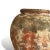A piece of Indonesian daily life, preserved in clay. This vintage vase was handcrafted by local artisans, its warm,...