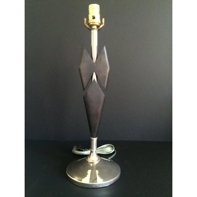 Nickel plated table lamp with ebonized wood details. Newly re-wired and ready for its close up. Updated Mid Century vibe.