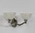 EZAN - Jean Gauthier A pair of French art deco double wall sconces in nickel plated copper alloy (bronze or solid brass)....