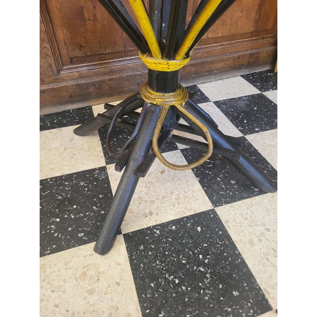 Vintage painted wooden table from the 70s. Top in woven chestnut and rattan structure. H.73 d.82 cm. It is in good...