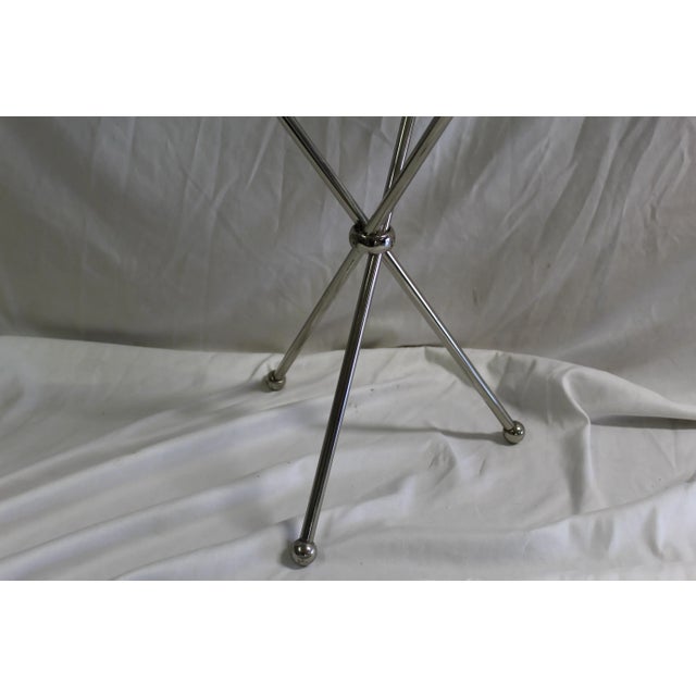 A Mid Century ,Deco design of a small side table made for an Interior Designer in Los Angeles . Custom hi-polished metal...