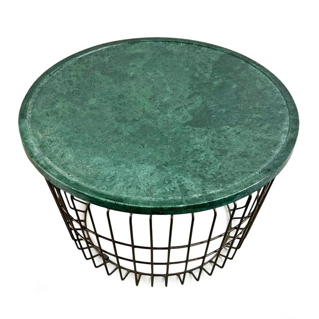 Beautiful green stain marble top round coffee table with black wire basket base. Unique and modern and will add interest...