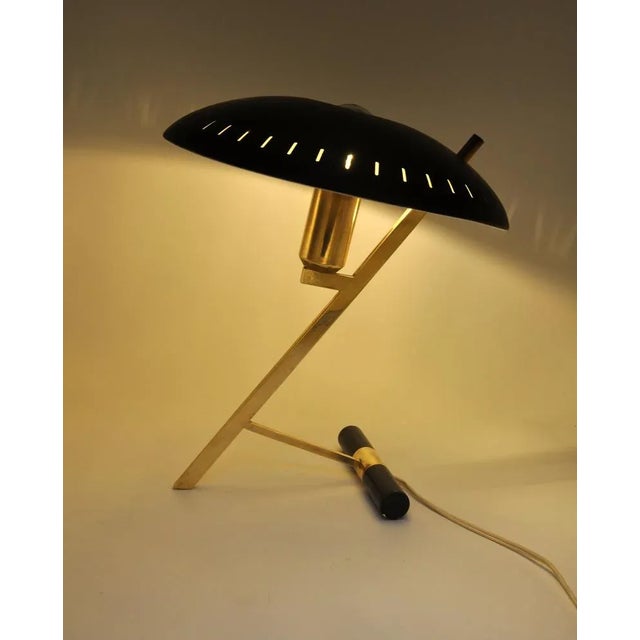 This iconic “Decora” table or desk lamp, also often called Model Z, was designed in 1956 by the famous architect and...