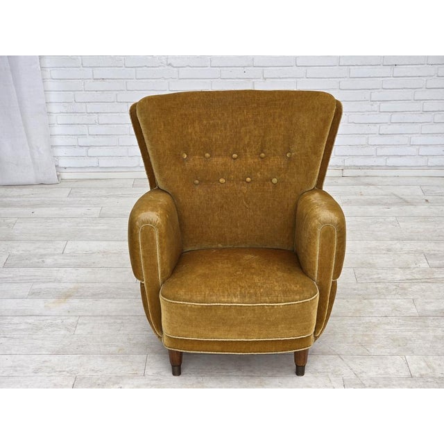 1960s, Danish relax chair. Original honey yellow furniture velour, beech wood legs with brass plugs, brass springs in the...