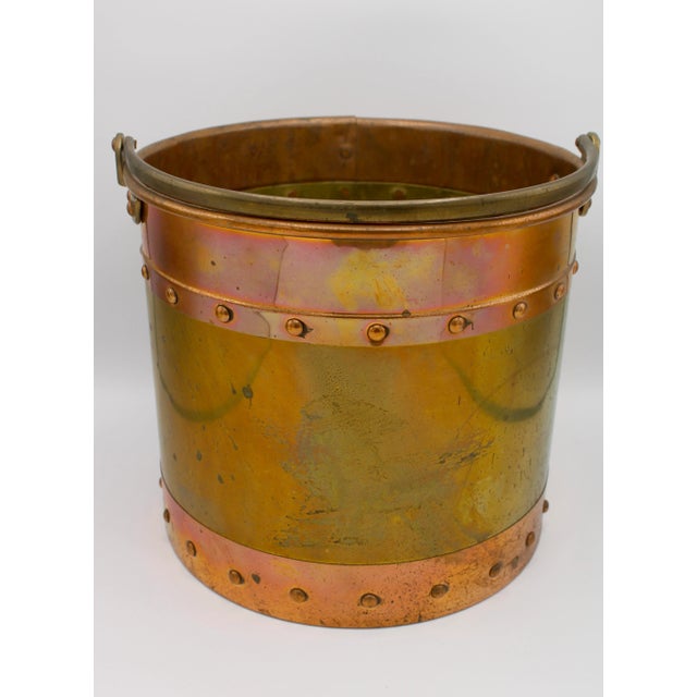 An excellent brass and copper banded bucket with a studded design. This would make a lovely, large ice bucket or a...