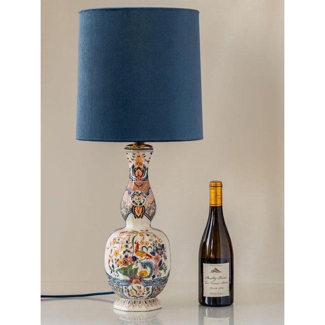 Antique french delft-revival polychrome faience table lamp with a new slate-blue velvet shade, richly hand-painted, newly...