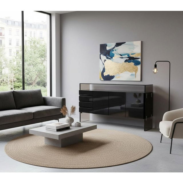 Discover an iconic design by Milo Baughman for Thayer Coggin, this meticulously restored black lacquer sideboard is the...