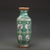 This elegant hexagonal porcelain vase features rich famille rose enamel work with a central panel depicting traditional...