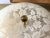 Lovely lacy 1950s floral damask pattern flush mount light in creamy white over transparent matte glass with inverted...