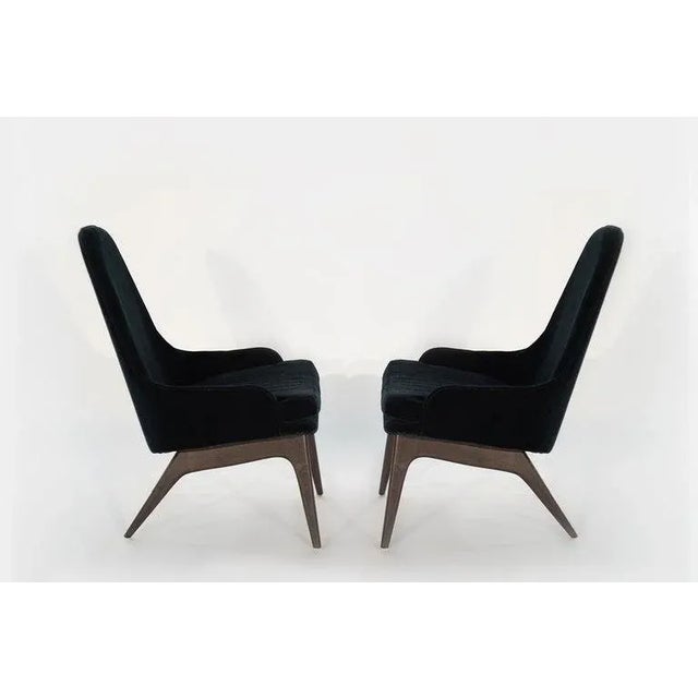 Sculptural set of slipper chairs designed by Adrian Pearsall for Craft Associates, circa 1950s. Walnut bases fully...