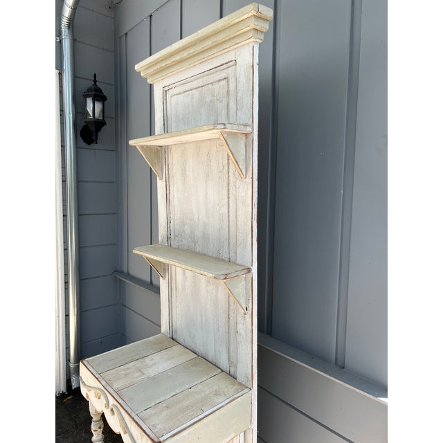 Charming vintage solid wood étagère with a tall, narrow profile and beautifully aged distressed cream finish. Features two...