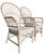 A beautiful pair of rattan armchairs with tall fan backs and a light, sun-washed finish. The airy, sculptural lines give...