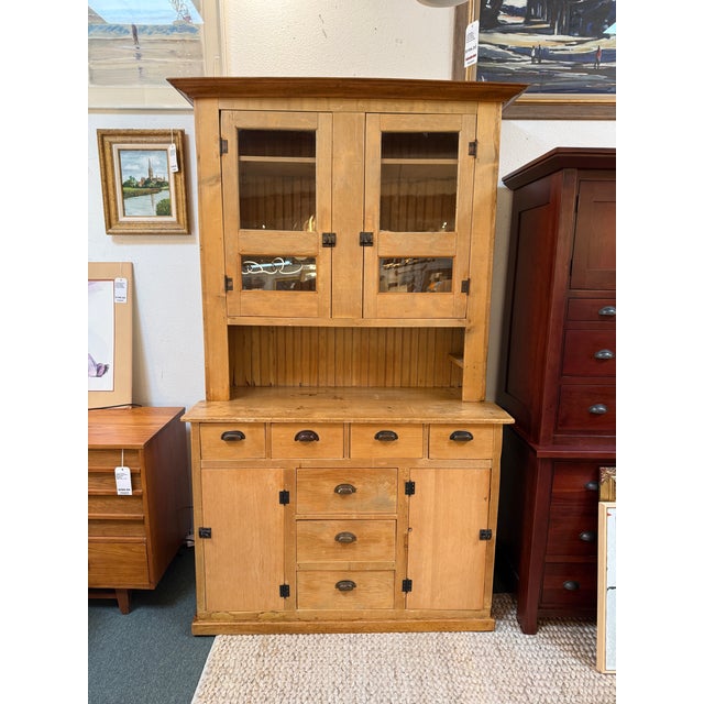 Design Plus Gallery presents a Mexican Pine Wood Hutch. This versatile piece combines storage and display with elegance...