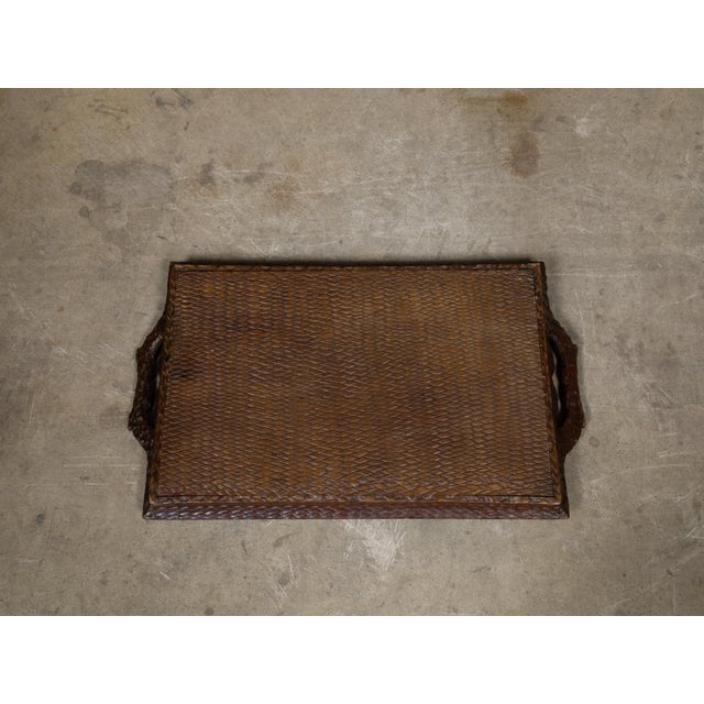 A richly carved Black Forest serving tray in oak, dating to the late 19th century, circa 1880. This hand-carved piece...