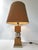 Good overall condition, but the gold plating on both the globe and the base has faded. Lampshade in good condition. Works....