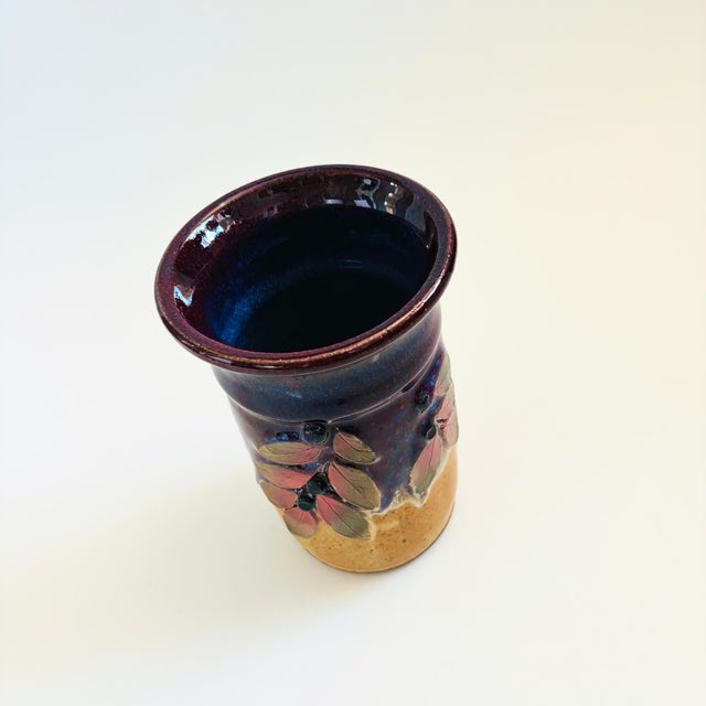 A vintage Montana art pottery "Huckleberry" vase by ceramicist, Tom Briney of Mountain Brook Studio. Features a beautiful...