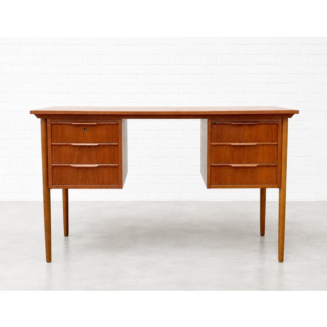 Beautifully scaled Mid Century Modern Danish teak desk c. 1960s, ideal for apartment living or any space where refined...