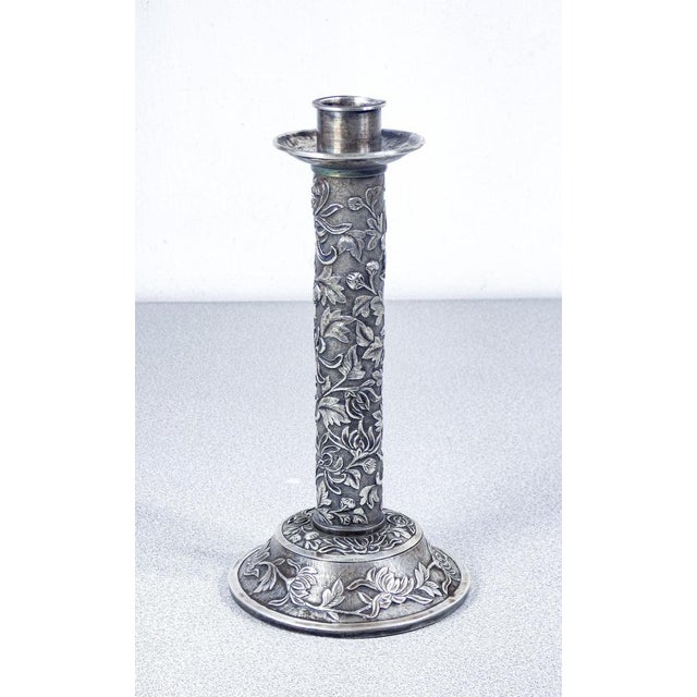 Embossed silver candlestick with plant and floral motifs. China, 19th century origin china period 19th century materials...