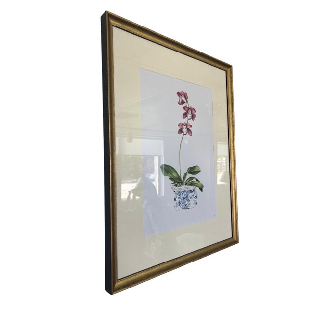 Elevate your space with this elegant pair of vintage framed botanical prints, featuring beautifully detailed orchid...