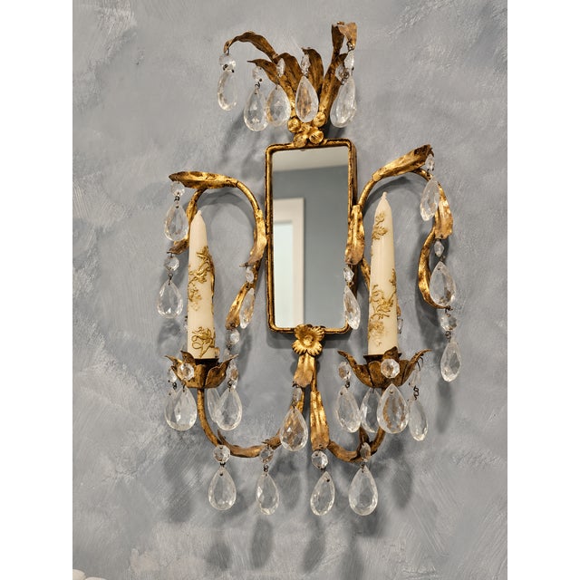 Enhance the ambiance of your living space with this exquisite antique Italian sconce. The elegantly designed tole gilt...